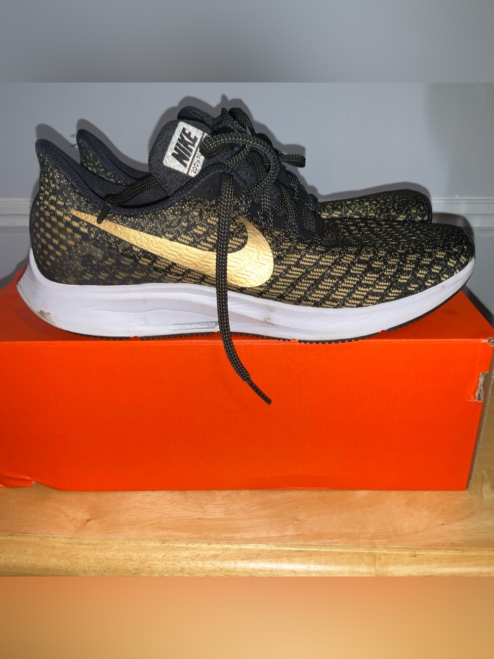 Nike Black and Gold Flyknit Running Sneakers